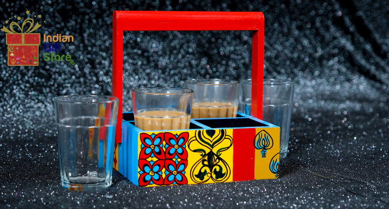 Four Chai cups with matching decorative holder