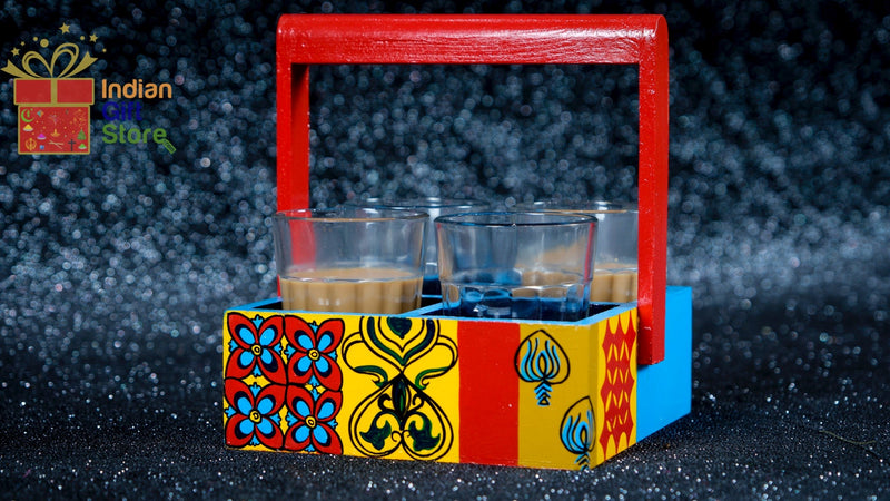 Four Chai cups with matching decorative holder