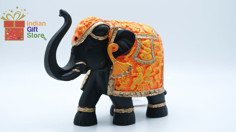 Hand-painted black and orange miniature elephant figurine