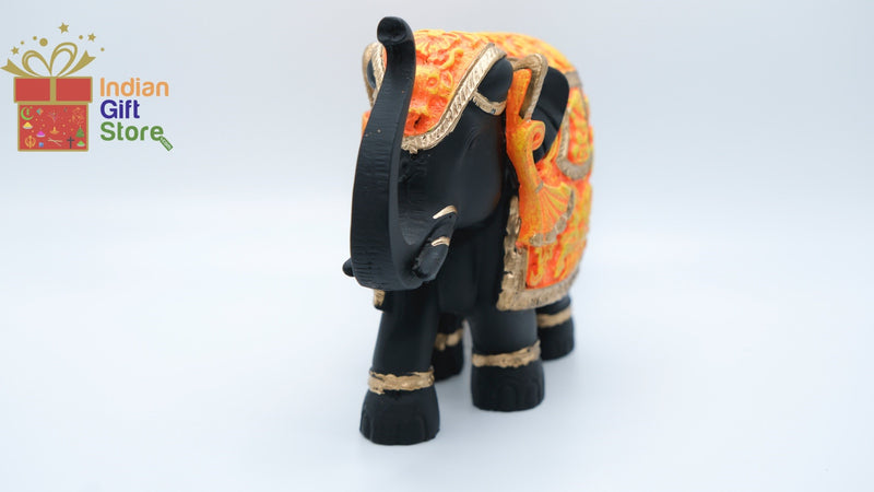 Hand-painted black and orange miniature elephant figurine
