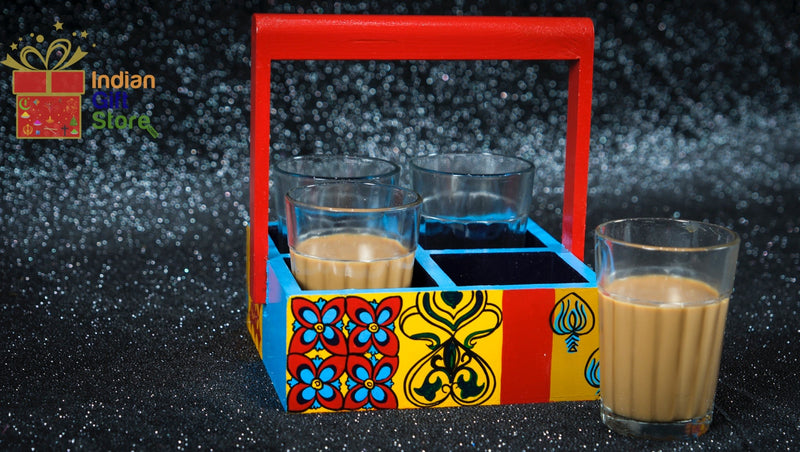 Four Chai cups with matching decorative holder